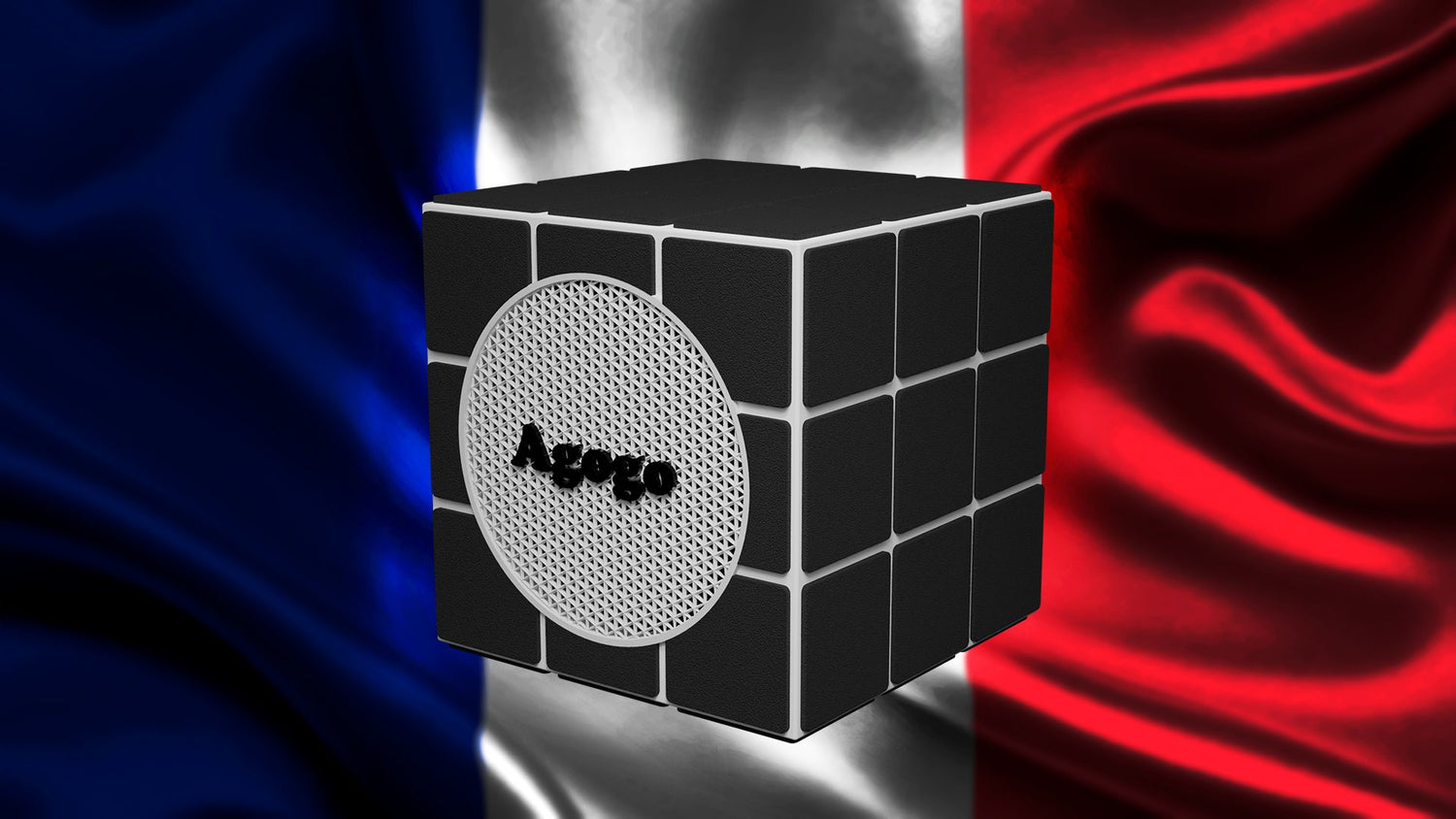 Photo d'une enceinte portable Agogo avec un drapeau français en fond, fabriquée à Paris